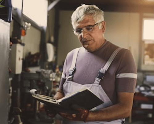 Mature-worker-industrial-paperwork-e1605580107926-web