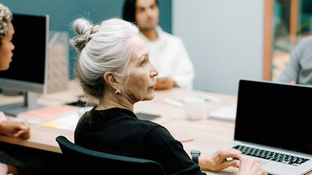 older women at a board meeting